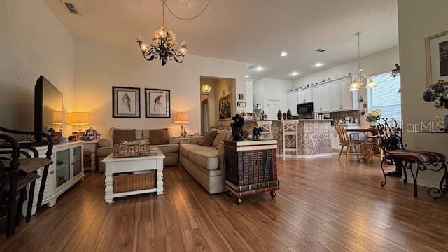 7415 Devereaux St, Reunion, FL 34747 - living area with a chandelier, dark wood-style flooring, and recessed lighting