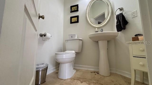 7415 Devereaux St, Reunion, FL 34747 - bathroom with toilet and baseboards