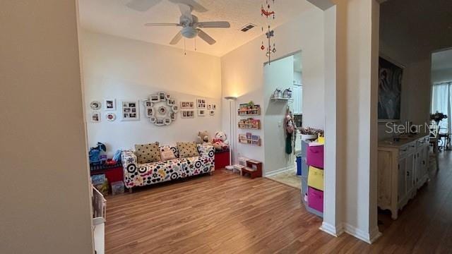 7415 Devereaux St, Reunion, FL 34747 - game room with wood finished floors and a ceiling fan