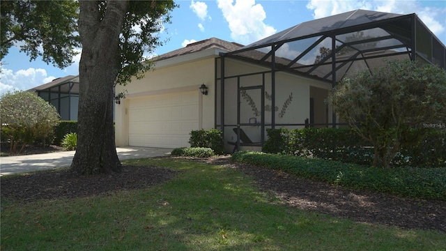 7415 Devereaux St, Reunion, FL 34747 - view of front of property with stucco siding, a garage, concrete driveway, glass enclosure, and a front yard
