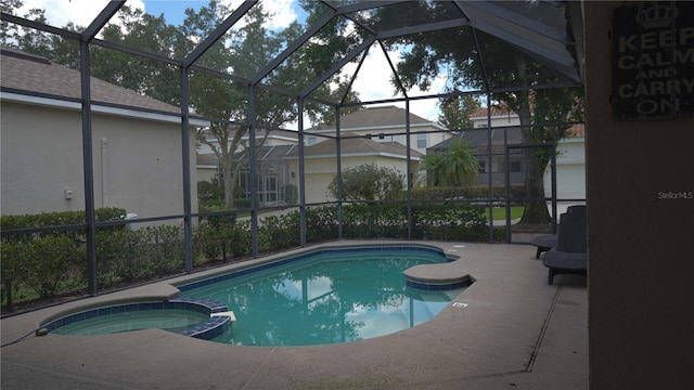 7415 Devereaux St, Reunion, FL 34747 - view of pool featuring a lanai, a pool with connected hot tub, and a patio