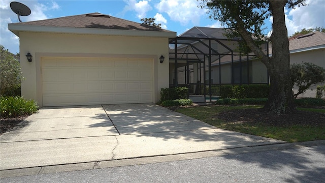 7415 Devereaux St, Reunion, FL 34747 - view of front of property featuring stucco siding, concrete driveway, a garage, and a lanai
