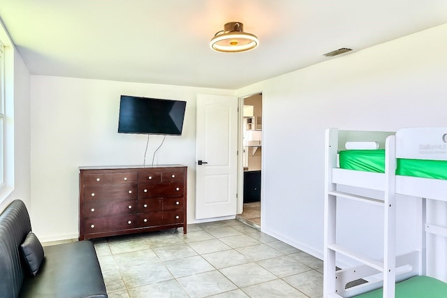 3328 Fox Rdg, Winter Haven, FL 33884 - bedroom featuring light tile patterned floors and baseboards