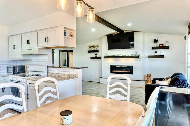 3328 Fox Rdg, Winter Haven, FL 33884 - dining space featuring a glass covered fireplace and baseboards