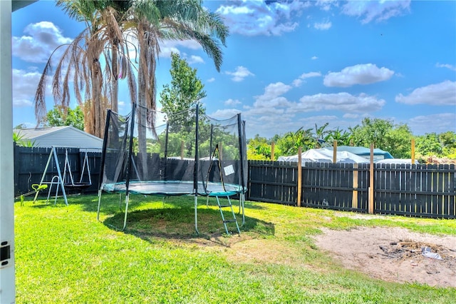 3328 Fox Rdg, Winter Haven, FL 33884 - fenced backyard with a trampoline