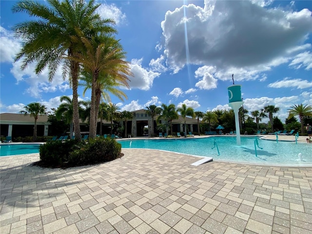 community pool with a patio area
