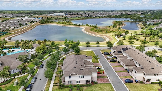 aerial view of residential area with a large body of water