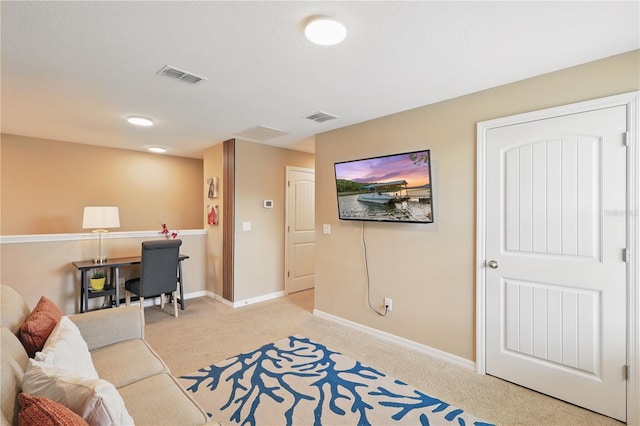 living room with light colored carpet, baseboards, and an office area