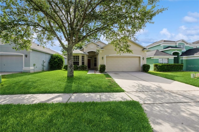 14208 Morning Frost Dr, Orlando, FL 32828 - view of front facade featuring concrete driveway, a garage, stucco siding, and a front yard