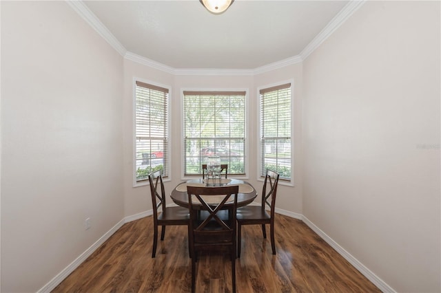 14208 Morning Frost Dr, Orlando, FL 32828 - dining room with baseboards, a healthy amount of sunlight, crown molding, and wood finished floors