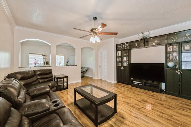14208 Morning Frost Dr, Orlando, FL 32828 - living area with ceiling fan, wood finished floors, ornamental molding, and arched walkways