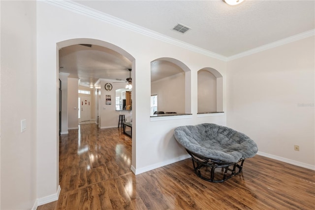 14208 Morning Frost Dr, Orlando, FL 32828 - interior space with crown molding, a ceiling fan, visible vents, and wood finished floors