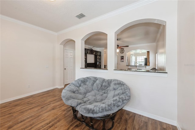 14208 Morning Frost Dr, Orlando, FL 32828 - sitting room with ornamental molding, baseboards, visible vents, and wood finished floors