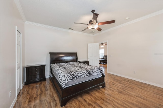 14208 Morning Frost Dr, Orlando, FL 32828 - bedroom with ornamental molding, baseboards, visible vents, and wood finished floors