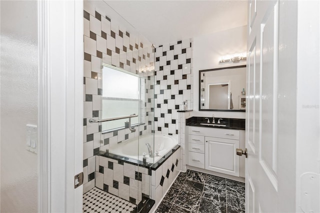 14208 Morning Frost Dr, Orlando, FL 32828 - full bathroom featuring vanity, a bath, and marble finish floor