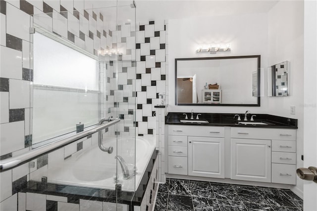 14208 Morning Frost Dr, Orlando, FL 32828 - full bathroom featuring a sink, double vanity, a garden tub, and marble finish floor