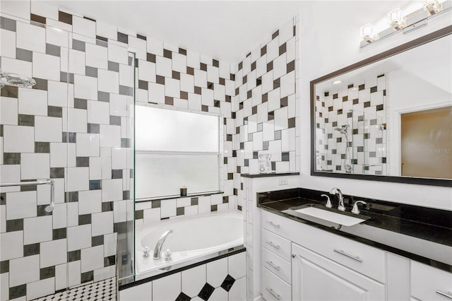 14208 Morning Frost Dr, Orlando, FL 32828 - bathroom featuring a bath, vanity, and a tile shower