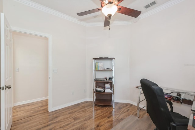 14208 Morning Frost Dr, Orlando, FL 32828 - home office with ceiling fan, crown molding, visible vents, and wood finished floors