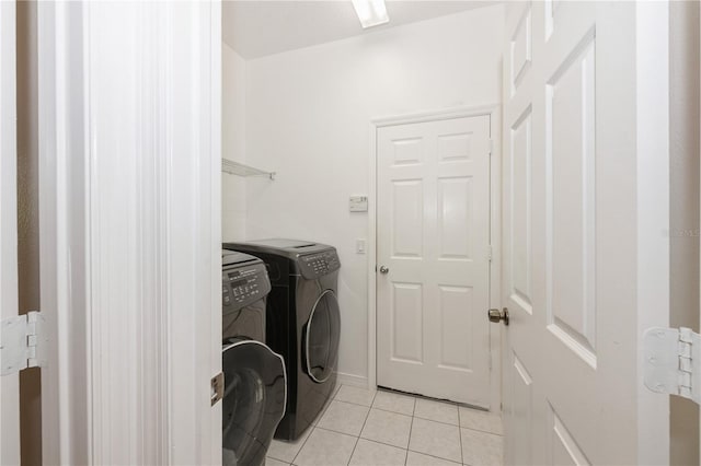 14208 Morning Frost Dr, Orlando, FL 32828 - laundry area with light tile patterned floors, separate washer and dryer, and laundry area