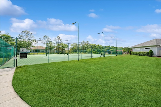 14208 Morning Frost Dr, Orlando, FL 32828 - view of sport court with a yard and fence
