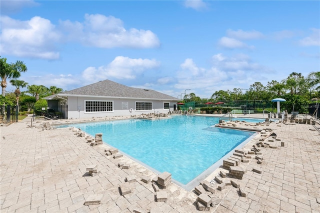 14208 Morning Frost Dr, Orlando, FL 32828 - community pool with fence and a patio