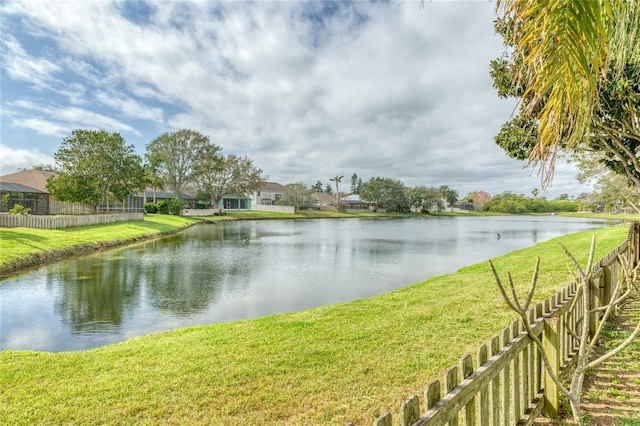 property view of water featuring fence