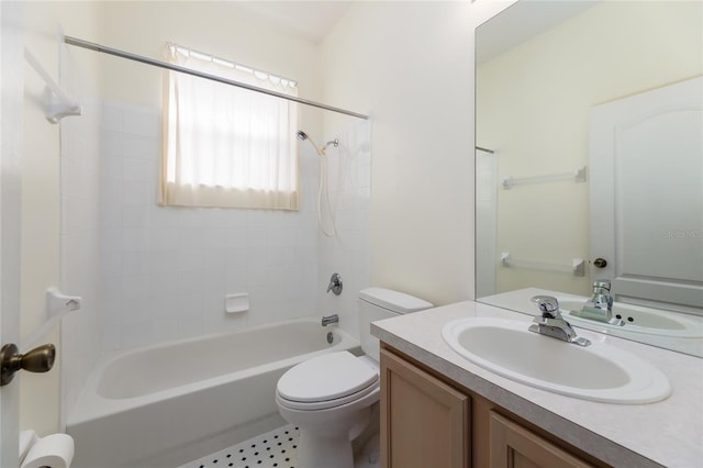 bathroom with bathing tub / shower combination, vanity, and toilet