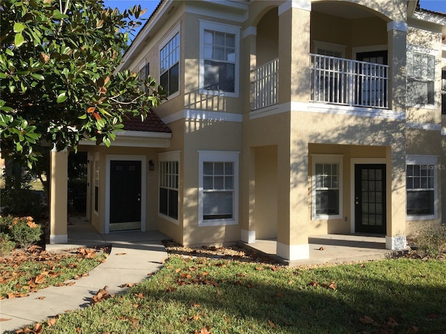 711 Arbor Lakes Cir Unit 711, Sanford, FL 32771 - view of front of property with stucco siding and a balcony