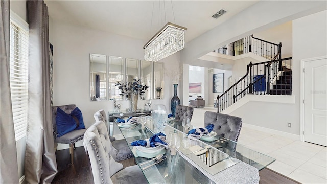 4002 Scarlet Branch Rd, Orlando, FL 32824 - dining room with visible vents, stairway, baseboards, tile patterned floors, and a notable chandelier