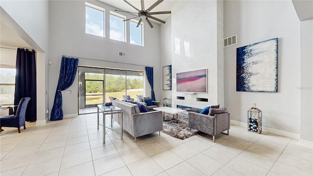 4002 Scarlet Branch Rd, Orlando, FL 32824 - living area featuring baseboards, a high ceiling, tile patterned floors, and visible vents