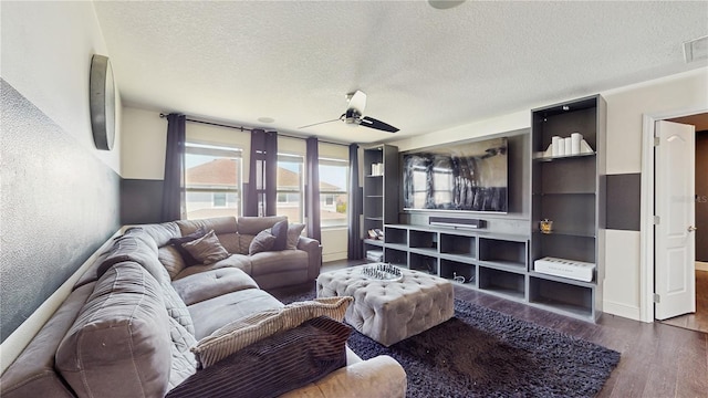 4002 Scarlet Branch Rd, Orlando, FL 32824 - living area with a textured ceiling, ceiling fan, wood finished floors, and visible vents