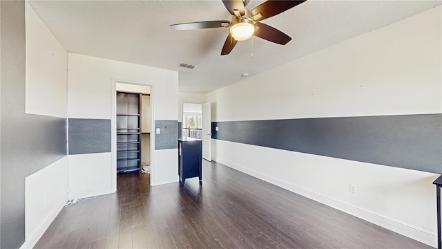 4002 Scarlet Branch Rd, Orlando, FL 32824 - spare room with baseboards, dark wood finished floors, ceiling fan, and visible vents