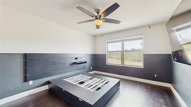 4002 Scarlet Branch Rd, Orlando, FL 32824 - unfurnished bedroom featuring baseboards, ceiling fan, and wood finished floors