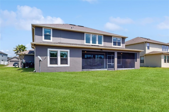 4002 Scarlet Branch Rd, Orlando, FL 32824 - rear view of house with a sunroom, stucco siding, and a yard
