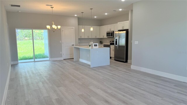 306 Marion Oaks Crse, Ocala, FL 34473 - kitchen featuring stainless steel appliances, baseboards, a chandelier, open floor plan, and recessed lighting