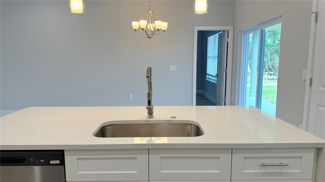 306 Marion Oaks Crse, Ocala, FL 34473 - kitchen with a sink, stainless steel dishwasher, a chandelier, and white cabinetry