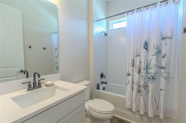 full bath with shower / tub combo, toilet, and vanity