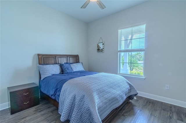 bedroom with baseboards, a ceiling fan, and wood finished floors