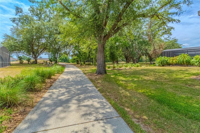 view of property's community featuring a yard