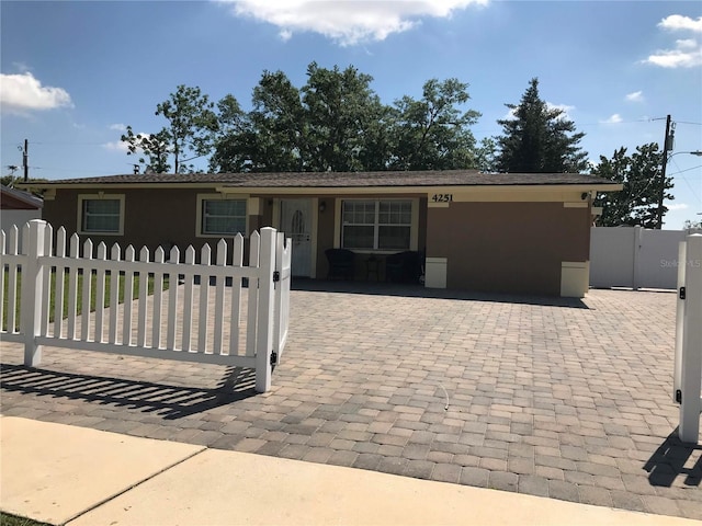 4251 Anthony Ln, Orlando, FL 32822 - view of front of home with stucco siding, a gate, and a fenced front yard