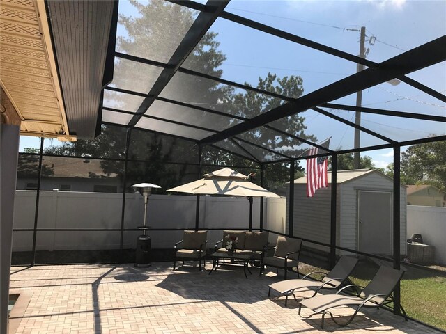 4251 Anthony Ln, Orlando, FL 32822 - view of patio / terrace featuring an outdoor living space, fence, an outbuilding, a lanai, and a storage unit