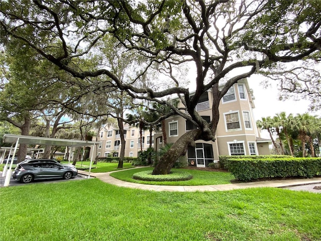 view of home's community featuring a lawn