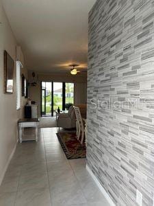 5060 Arancia Ln, Ave Maria, FL 34142 - corridor with tile patterned flooring and baseboards