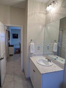 5060 Arancia Ln, Ave Maria, FL 34142 - bathroom with tile patterned flooring and vanity