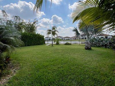 5060 Arancia Ln, Ave Maria, FL 34142 - view of yard featuring fence