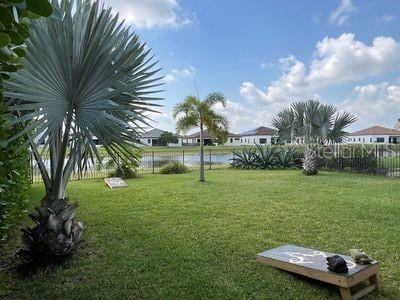 5060 Arancia Ln, Ave Maria, FL 34142 - view of yard featuring a water view and fence