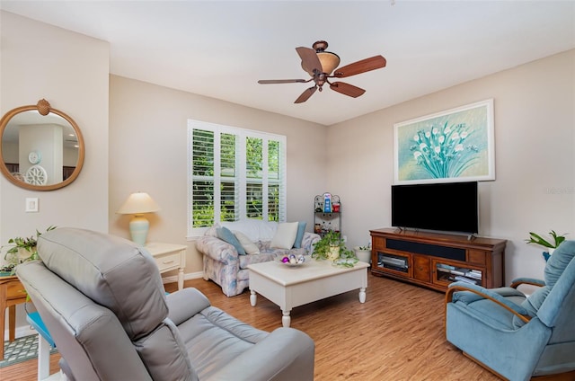 3321 San Jacinto Cir Unit 116, Sanford, FL 32771 - living area featuring wood finished floors, a ceiling fan, and baseboards