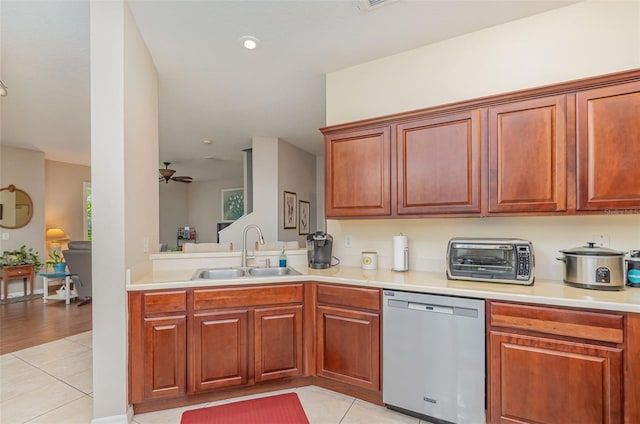 3321 San Jacinto Cir Unit 116, Sanford, FL 32771 - kitchen with stainless steel dishwasher, a sink, light tile patterned floors, and light countertops