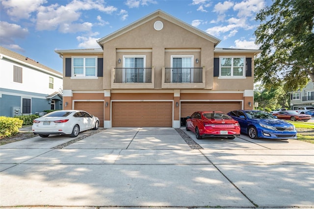 3321 San Jacinto Cir Unit 116, Sanford, FL 32771 - multi unit property with concrete driveway, stucco siding, and a garage