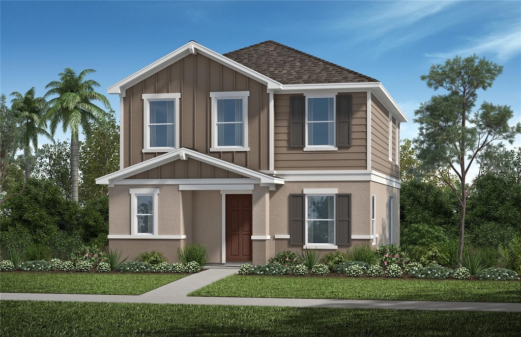 traditional home with board and batten siding, a shingled roof, and a front yard